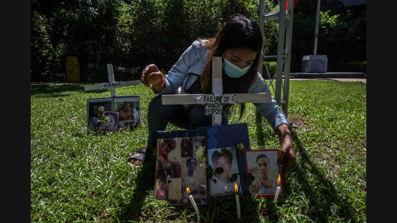 In the Philippines, those slain in the government’s war on drugs were remembered. Here, a relative of a victim of an extra-judicial killing is seen attending a memorial mass ahead of All Soul's Day, at the Commission on Human Rights in Manila on October 29, 2021.Photo: AFP